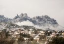 houses near mountain under white clouds